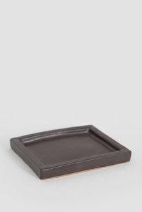 Donkerbruin glazed aardewerk schaaltje