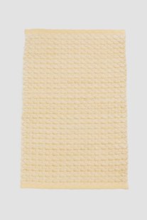 Gele badmat met patroon