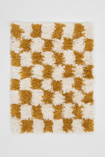 Geel-wit geblokte badmat