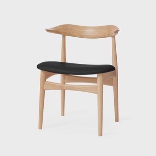 Warm Nordic Cow Horn Stoel leer zwart, witgeoliede eikenhouten poten