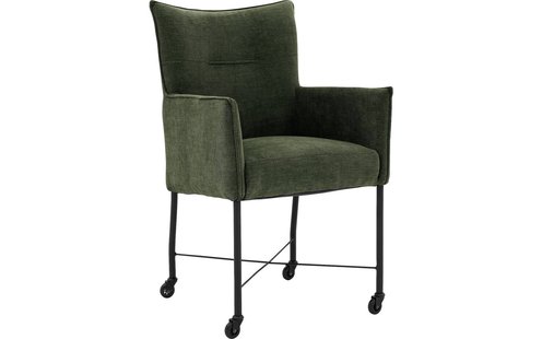 Goossens Eetkamerstoel Erik groen stof met armleuning en met wielenmet skaterwielen, modern design