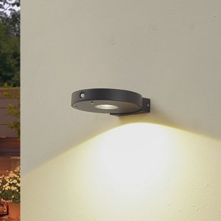 Lucande LED-zonne-wandlamp Tavon, rond, zwart, sensor