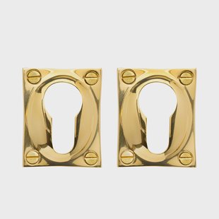 De Oude Deurklink Rechthoekige cilinderrozet in messing gelakt