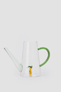 Glazen gieter met palmboom