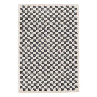 sweeek - Donkerblauw en crèmekleurig dambord vormig interieur tapijt