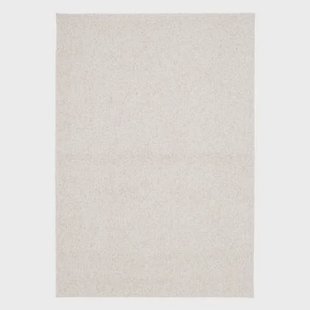 sweeek - Crème gevlekt interieurtapijt in bouclé