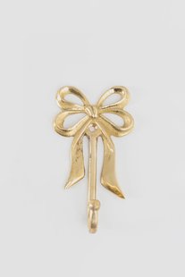 Goudkleurige wandhaak met strik