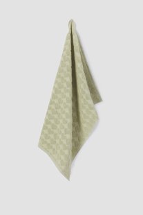 Lichtgroene handdoek met hartjes print