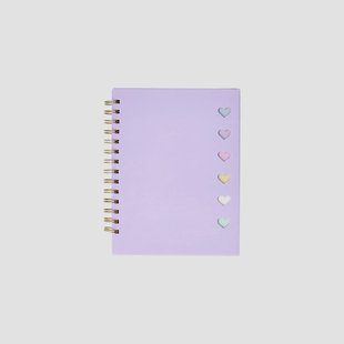 Paars notitieboekje met balpen en sticky memo's