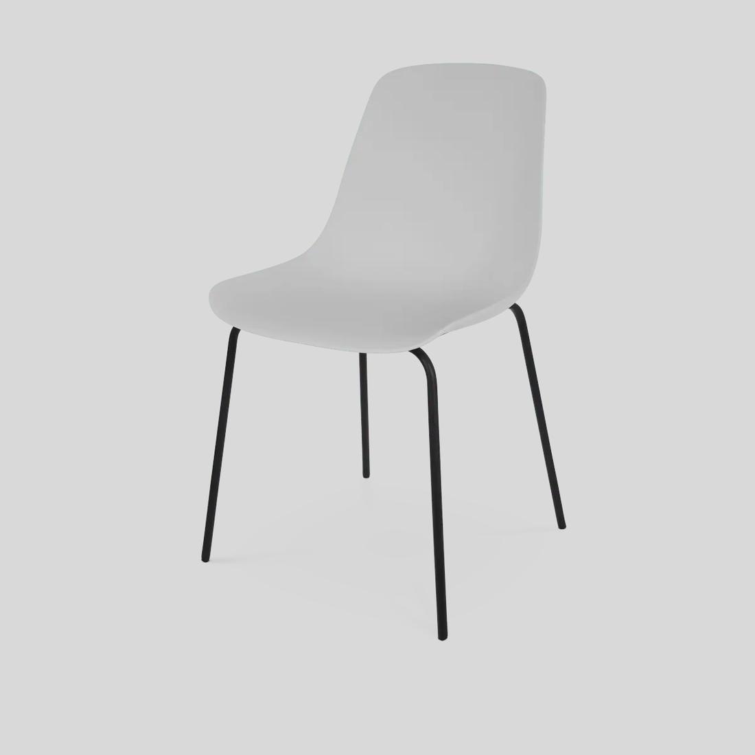 Bekijk deze stoel Zwarte slanke poten geven deze witte eetkamerstoel een verfijnde industriële uitstraling.