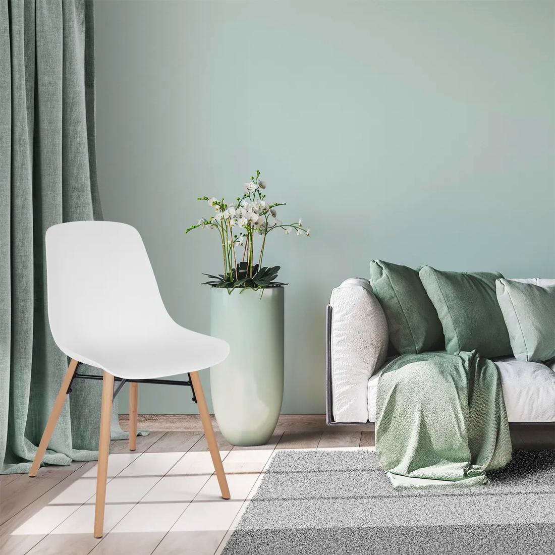 Bekijk deze stoel Deze witte kuipstoel ziet er stijlvol uit bij je landelijke interieur.